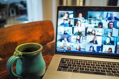 Group of people on zoom call on laptop